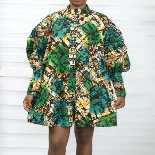 This short, long-sleeve casual dress features vibrant Original Adire African print, blending bold style with comfort. Perfect for any occasion, its eye-catching design and soft fabric make it a standout piece. Available in multiple sizes.